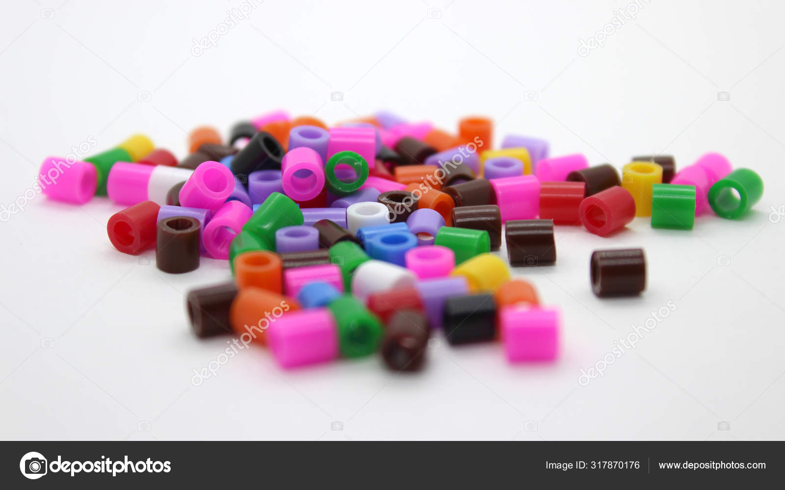 Colorful hobby craft pearls, kids toys concept Stock Photo by ©cereal__k  317870176